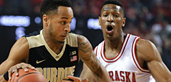 Purdue's Vince Edwards (12) drives past Nebraska's Andrew White III (3) during the first half of an NCAA college basketball game in Lincoln, Neb., Tuesday, March 1, 2016. (AP Photo/Nati Harnik)